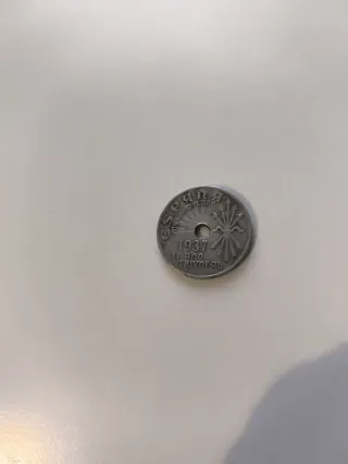 Moneda 25 centimos con agujero