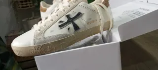 Zapatillas Premiata Doradas y Blancas