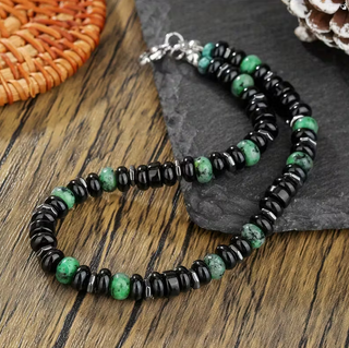 Pulsera negra con cuentas azuladas Pies Hombre