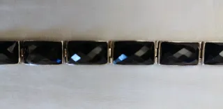 PULSERA DE PLATA CON GEMAS DE ONIX NEGRO FACETADAS