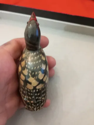 Scultura uccello in corno intagliato