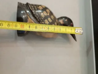 Scultura uccello in corno intagliato