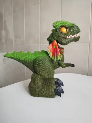Juguete Dinosaurio Verde  se articula hace sonidos