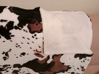 Manta y 2 cojines estampado vaca