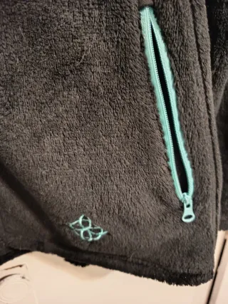 Chaqueta polar Crivit gris y turquesa