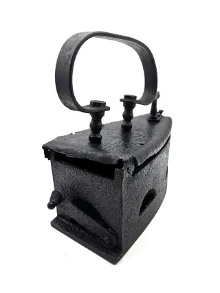 Plancha antigua de carbón de hierro forjado