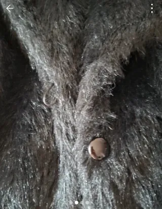 Torera pelo sintético negra, lleva forro