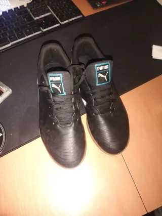 Botas de fútbol Puma negras y turquesa