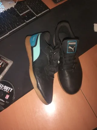 Botas de fútbol Puma negras y turquesa