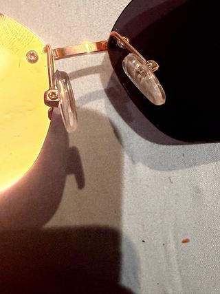 Occhiali da sole Miu Miu neri e dorati