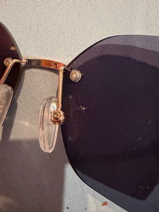 Occhiali da sole Miu Miu neri e dorati