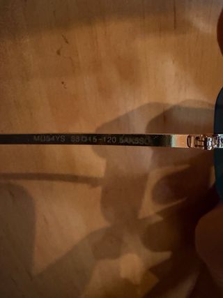 Occhiali da sole Miu Miu neri e dorati