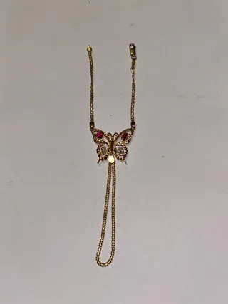 Pulsera esclava oro mariposa rubíes y brillantes