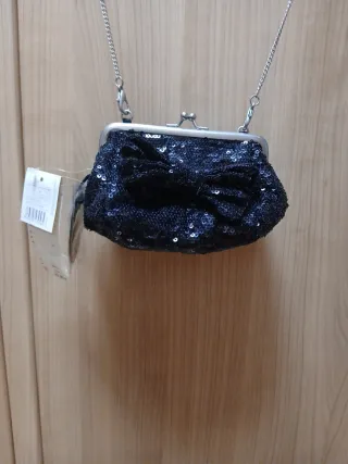 Bolso lentejuelas negro lazo cadena