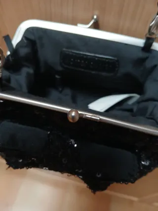 Bolso lentejuelas negro lazo cadena