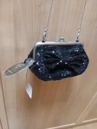 Bolso lentejuelas negro lazo cadena