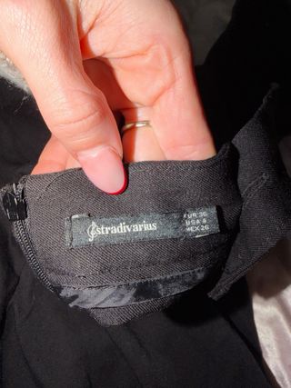 Mono peto negro con botones