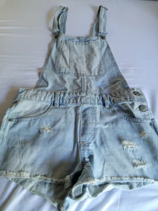 Peto vaquero corto desgastado