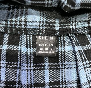 Falda cuadros plisada con encaje