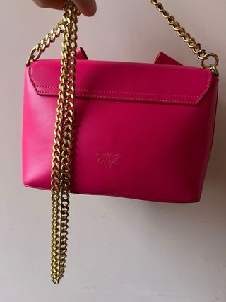 Borsa Pinko fucsia con fiocco e catena oro