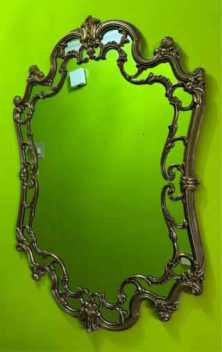 Espejo de pared bronce con marco ornamentado
