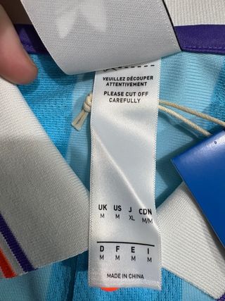 Maglietta Adidas a strisce blu e arancione