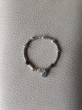 Pulsera Uno de 50 Bolitas Plata y Cuero
