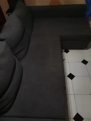 Sofá cama gris de tela