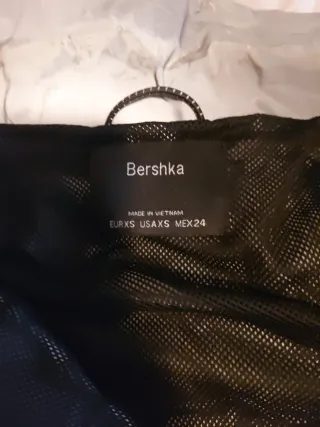 Chaqueta corta reflectante gris