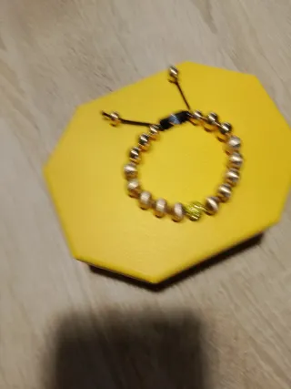 Pulsera Tesor Paris dorada y amarilla