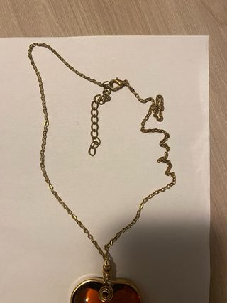 Ciondolo a forma di cuore ambra dorata