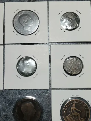 Lotto 12 monete romane e spagnole.