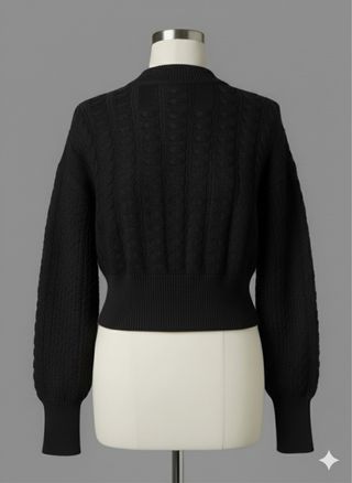 Maglione corto nero a trecce