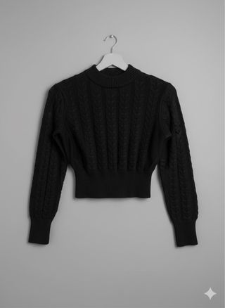 Maglione corto nero a trecce