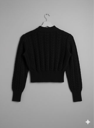 Maglione corto nero a trecce