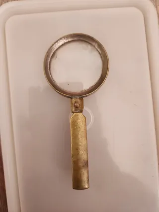 Antigua lupa plegable dorada