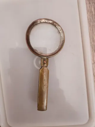 Antigua lupa plegable dorada