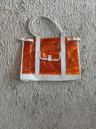 Bolso transparente naranja y blanco