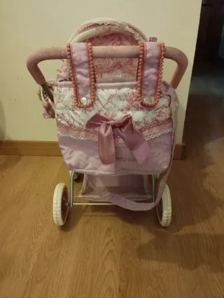 Carrito de muñecas rosa Martina
