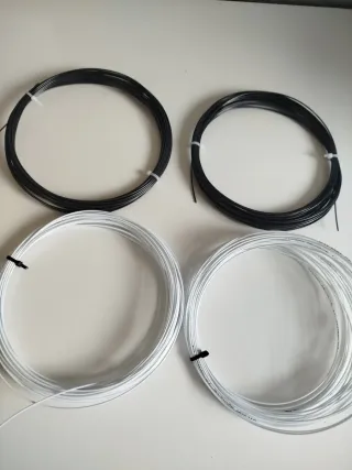 Wilson Revolve Cuerda Tenis Negra/Blanca