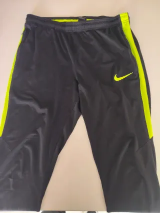 Pantalones Nike negros con rallas amarillas