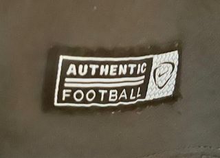 Camiseta Nike Dri-Fit Gris y Naranja