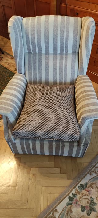 Sillón orejero tapizado para salón