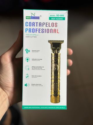 Máquina de afeitar/cortar pelo dorada