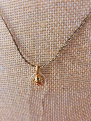 Colgante Tous y cordón trenzado dorado