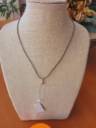 Colgante Tous y cordón trenzado dorado