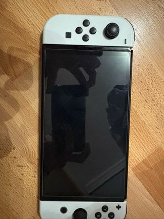 Nintendo Switch OLED + 4 giochi + Accessori