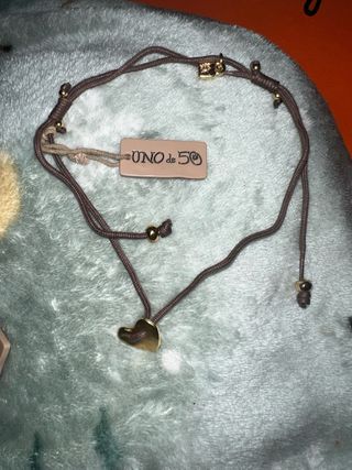 Colgante y pulsera Uno de 50 corazón.