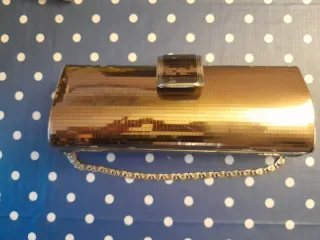 Bolso de fiesta dorado con cadena