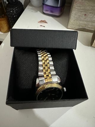 Reloj bicolor dorado y plateado